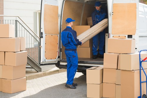 Professional movers handling furniture pick-up