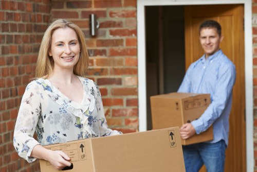 Removal team preparing office items for recycling during a move