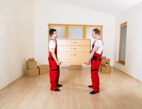 Movers unpacking and organizing in a new home